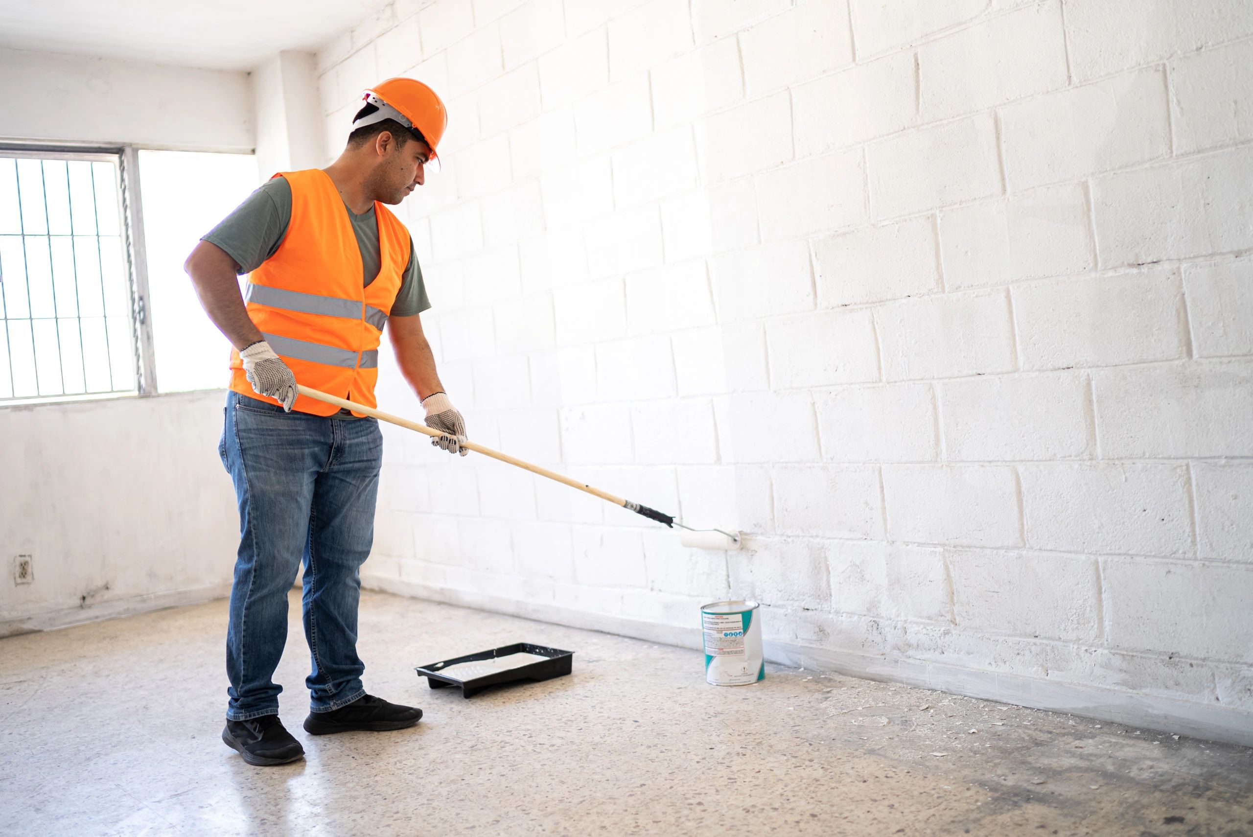 Installer working carefully on an interior coating project