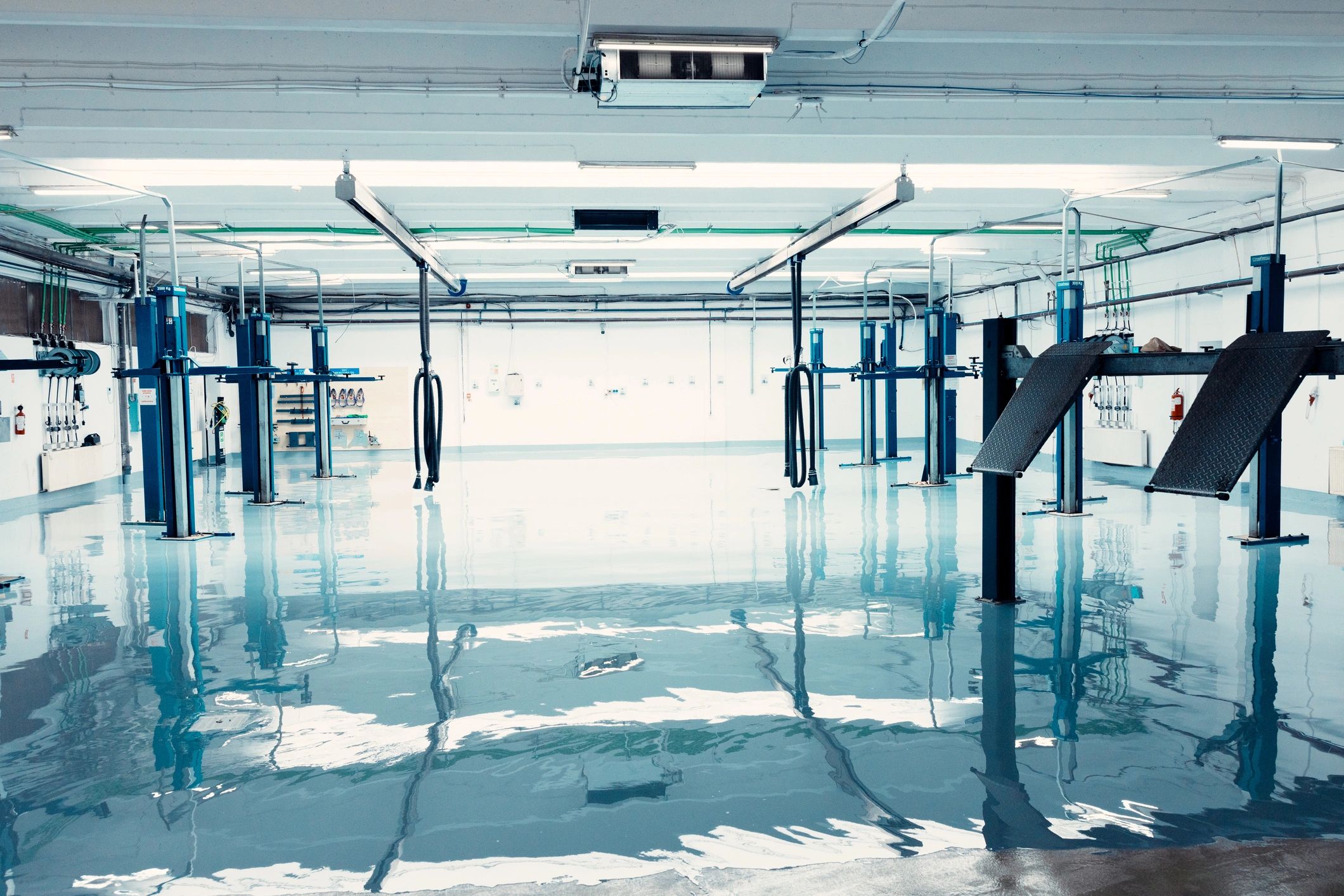 Auto shop with shiny epoxy-coated floor