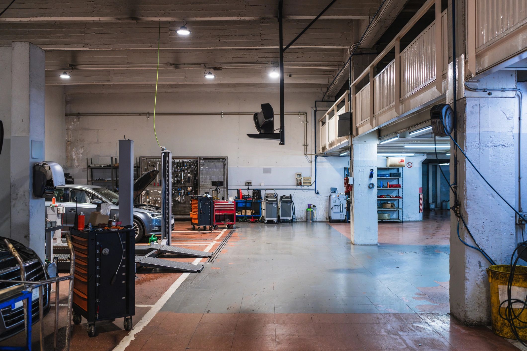 Service bay with durable coated flooring
